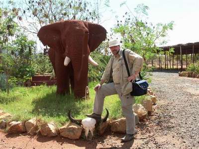  Karibu Red Elephant Lodge, I in front of an elephant statue 